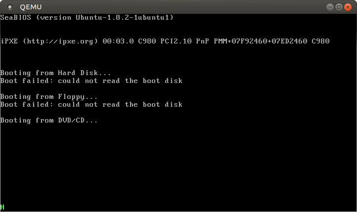 QEMU output with a green `H` in the lower left corner